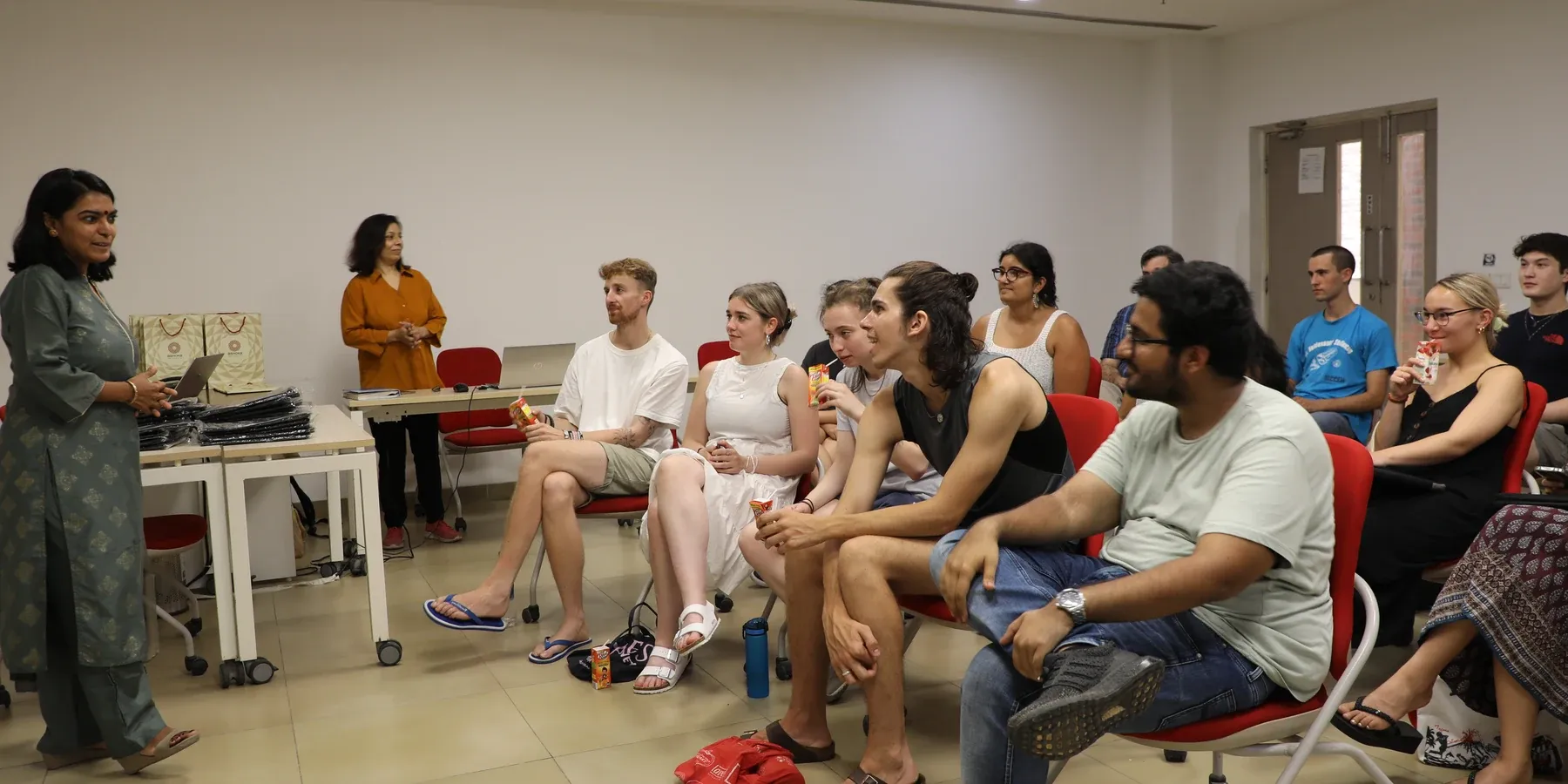 Auditorium stage session and student audience at Ashoka.